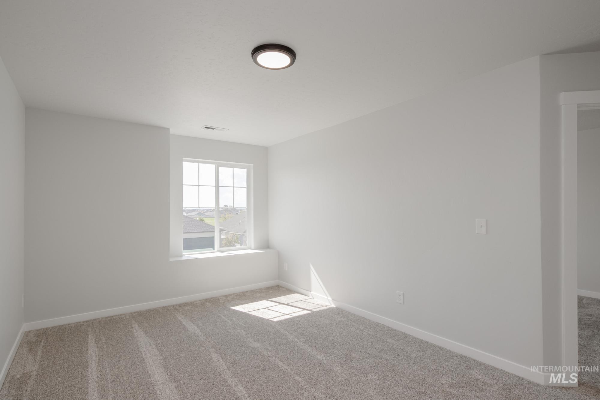 3270 West Morere Drive Meridian, ID 83642 - Photo 23 of 26 Unfurnished room featuring carpet floors and baseboards