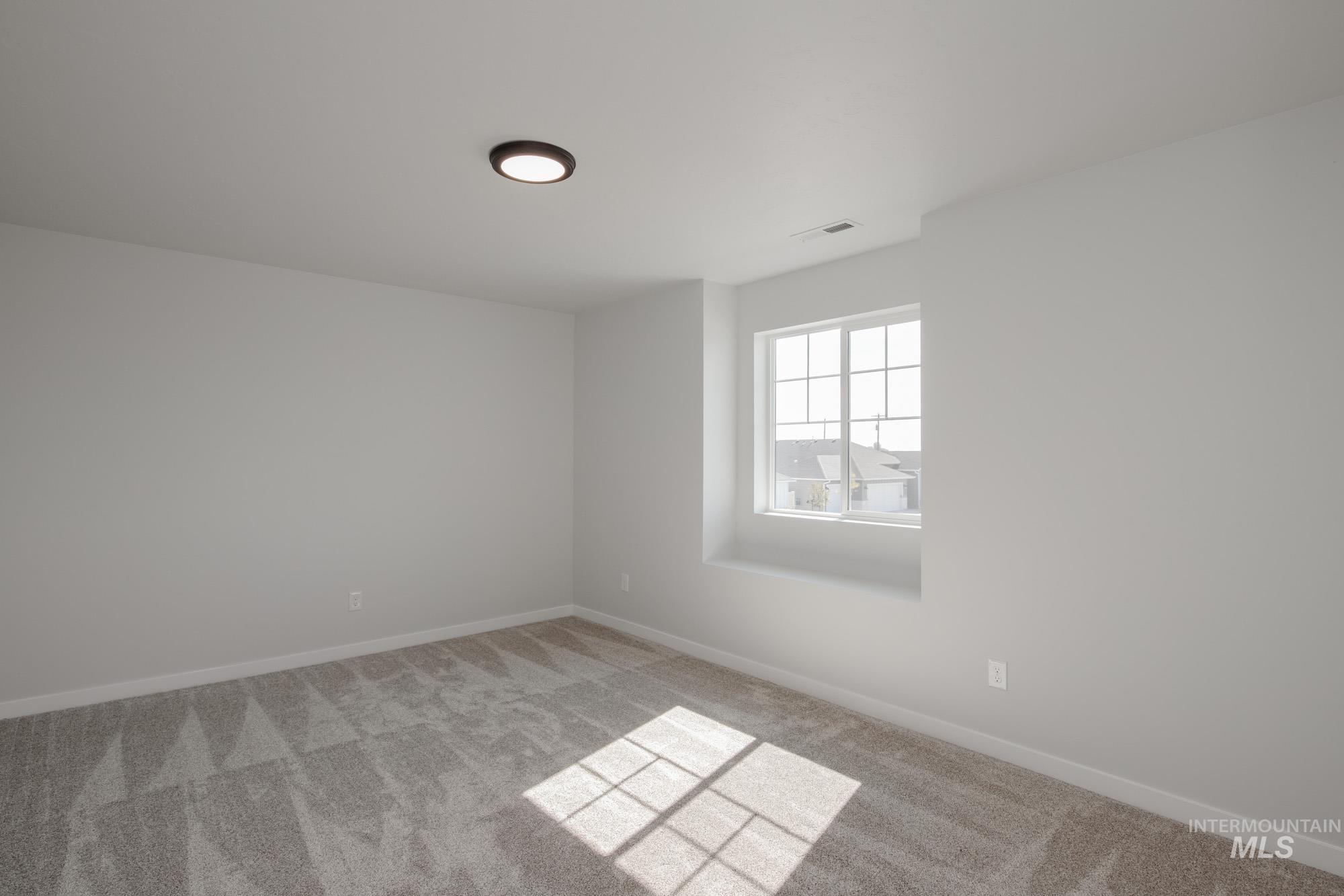 3270 West Morere Drive Meridian, ID 83642 - Photo 24 of 26 Unfurnished room with carpet flooring and baseboards