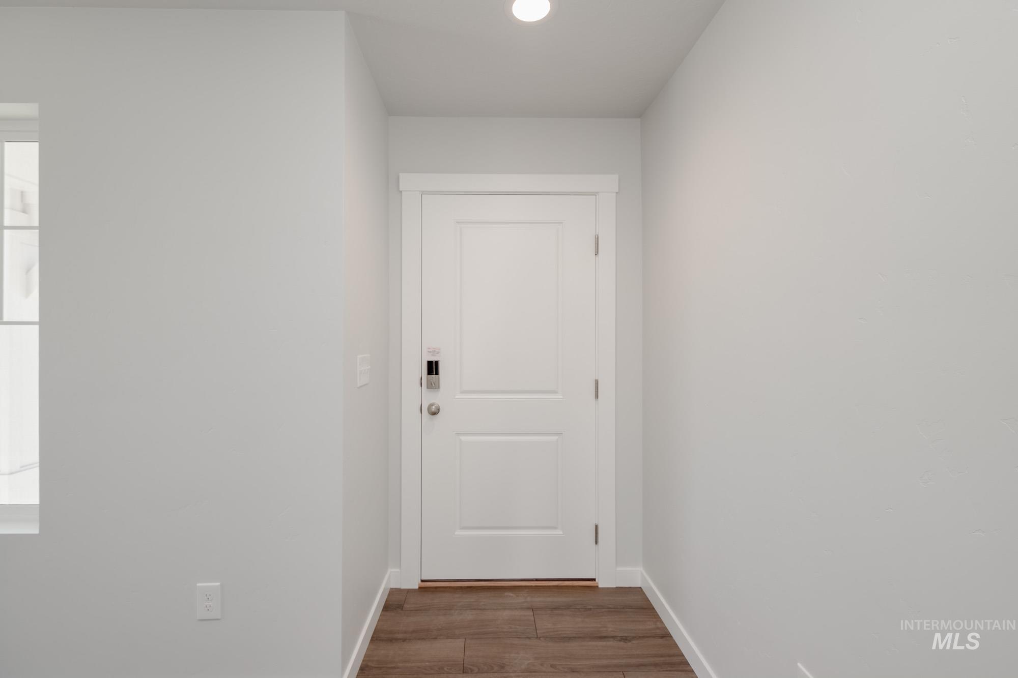 3270 West Morere Drive Meridian, ID 83642 - Photo 3 of 26 Doorway with wood finished floors and recessed lighting