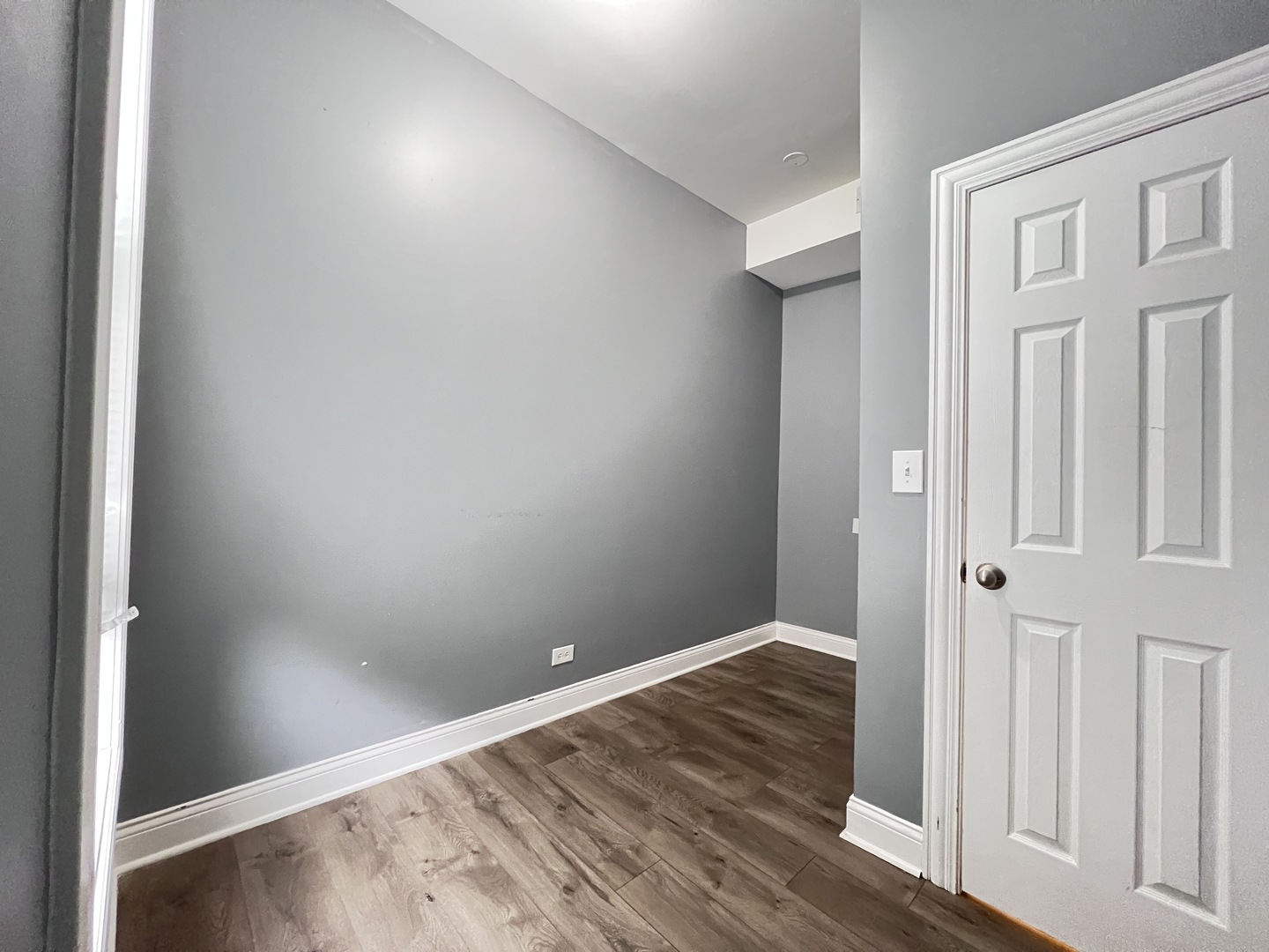 7057 South Normal Boulevard, Unit 2 Chicago, IL 60621 - Photo 28 of 46 wooden floor in an empty room