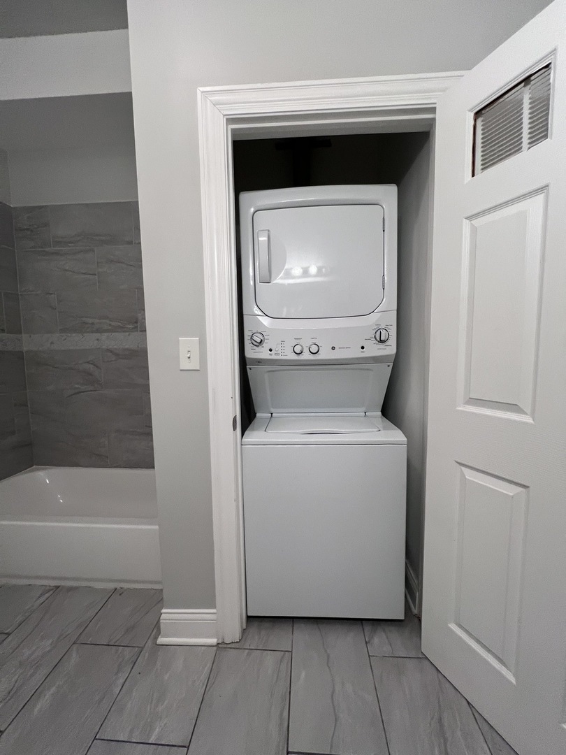 7057 South Normal Boulevard, Unit 2 Chicago, IL 60621 - Photo 35 of 46 a utility room with a washer and dryer