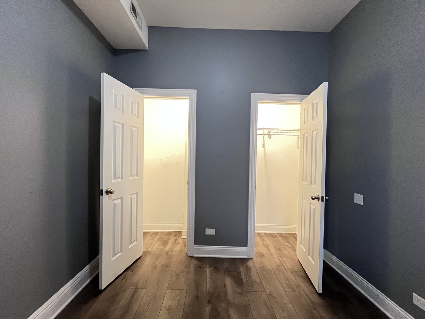 7057 South Normal Boulevard, Unit 2 Chicago, IL 60621 - Photo 40 of 46 a view of a hallway with wooden floor