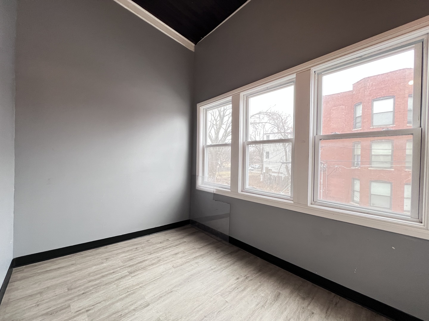 7057 South Normal Boulevard, Unit 2 Chicago, IL 60621 - Photo 41 of 46 a view of an empty room with a window