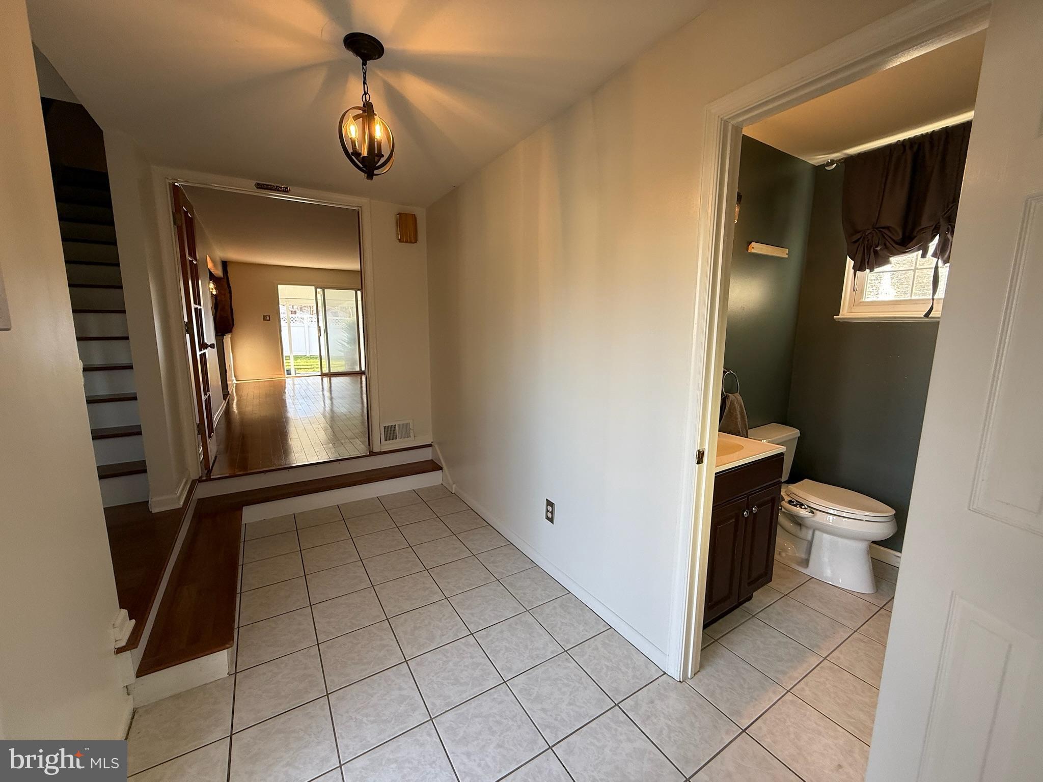 142 Fox Chase Drive Delran, NJ 08075 - Photo 17 of 26 a view of a hallway with wooden floor and a bathroom