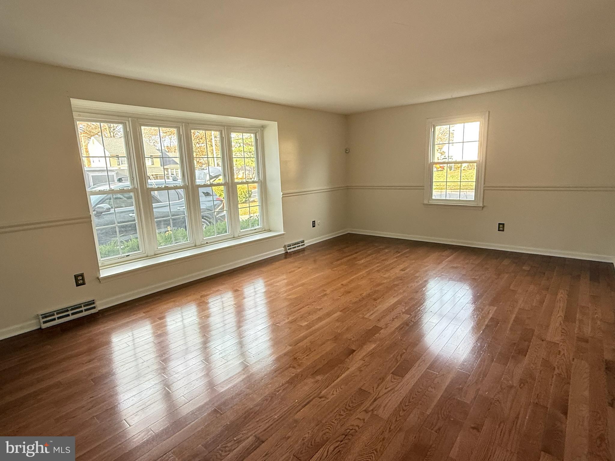 142 Fox Chase Drive Delran, NJ 08075 - Photo 3 of 26 a view of an empty room with wooden floor and a window