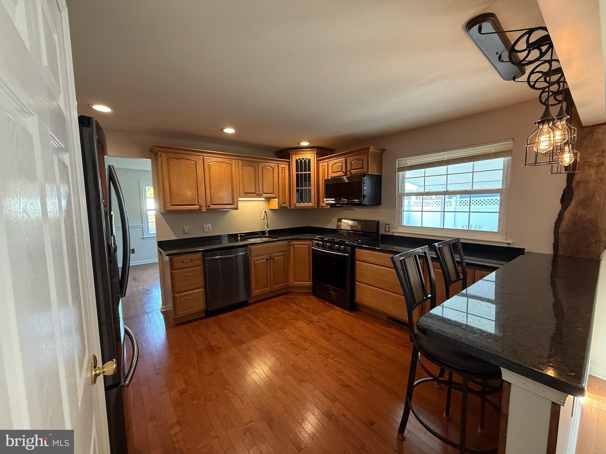 142 Fox Chase Drive Delran, NJ 08075 - Photo 10 of 26 a kitchen with granite countertop a sink a counter top space stainless steel appliances and cabinets