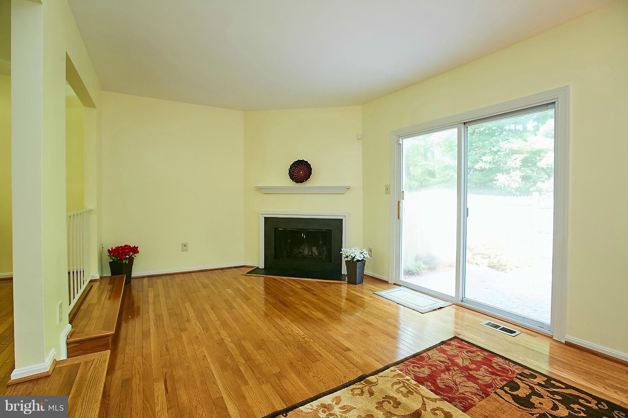 8567 Tyrolean Way Springfield, VA 22153 - Photo 11 of 29 a view of empty room with wooden floor and fan