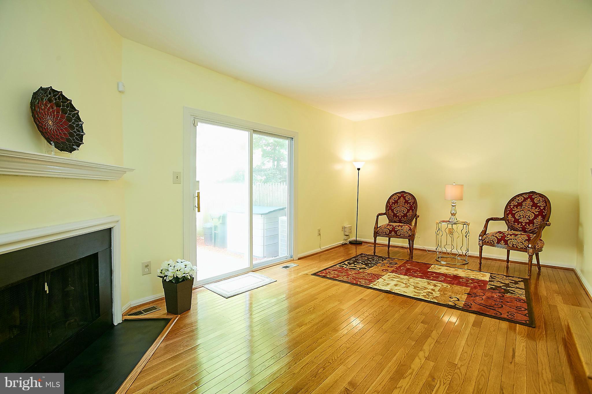 8567 Tyrolean Way Springfield, VA 22153 - Photo 13 of 29 a bedroom with a bed and wooden floor