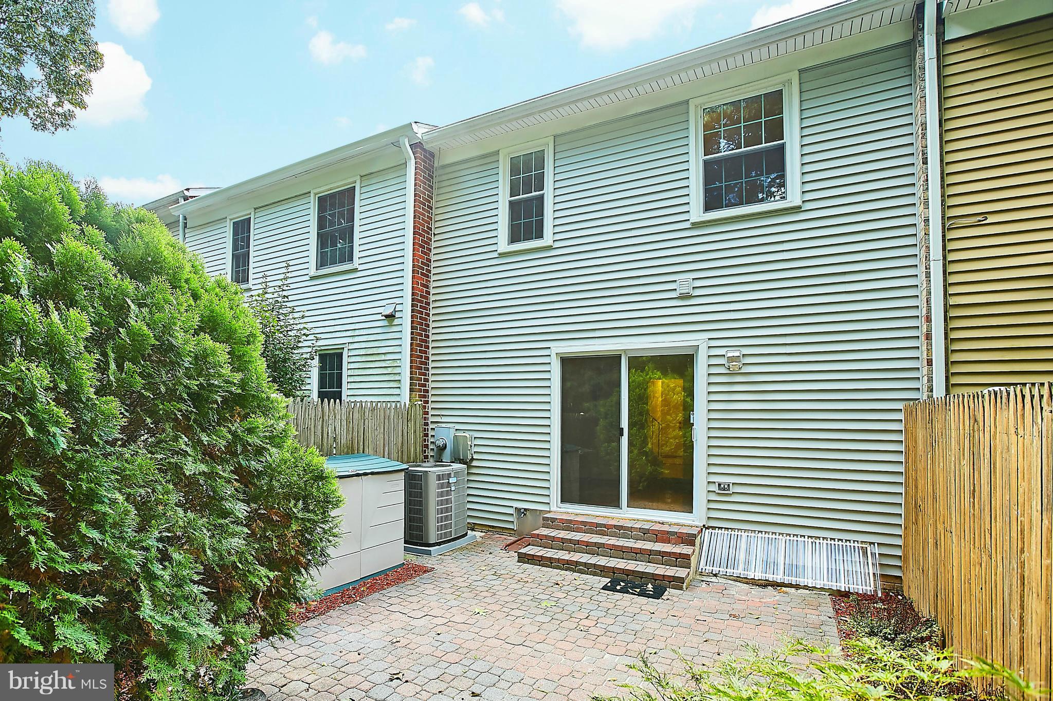 8567 Tyrolean Way Springfield, VA 22153 - Photo 27 of 29 a view of a house with a small yard and a large window