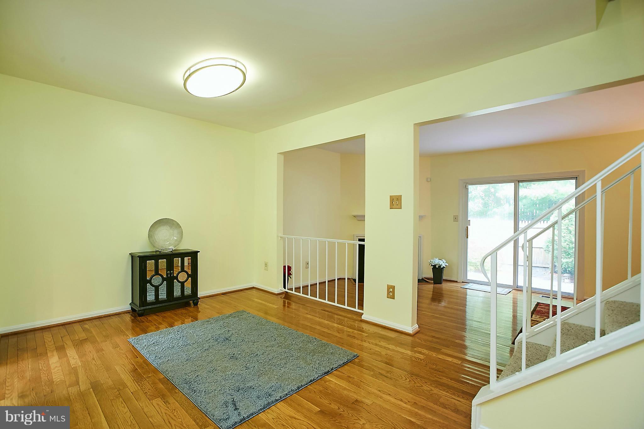 8567 Tyrolean Way Springfield, VA 22153 - Photo 7 of 29 a view of a livingroom with wooden floor