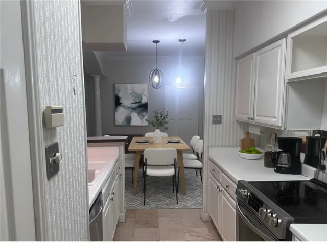 a kitchen with a sink and cabinets