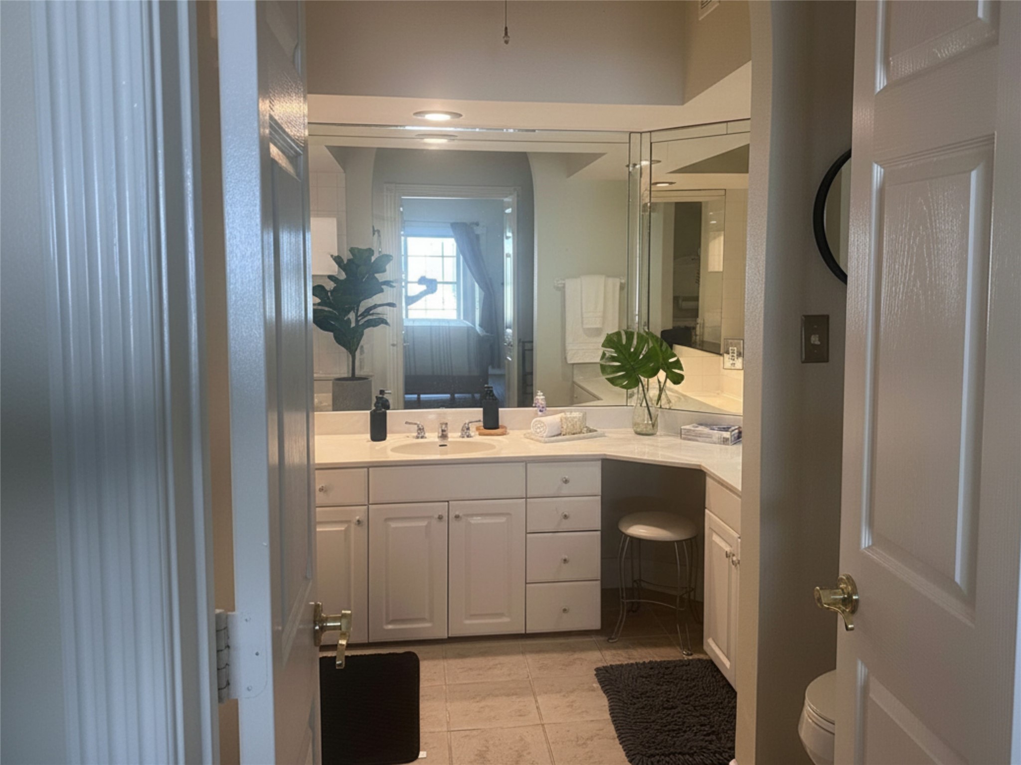 7347 Regency Square Court, Unit 7347 Houston, TX 77036 - Photo 7 of 12 a bathroom with a double vanity sink toilet and shower