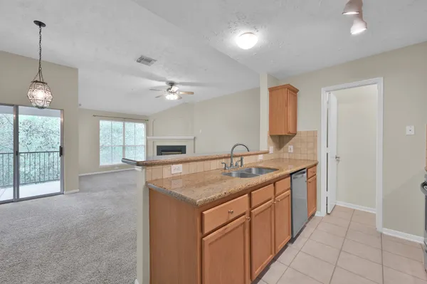 a kitchen with a sink and a window