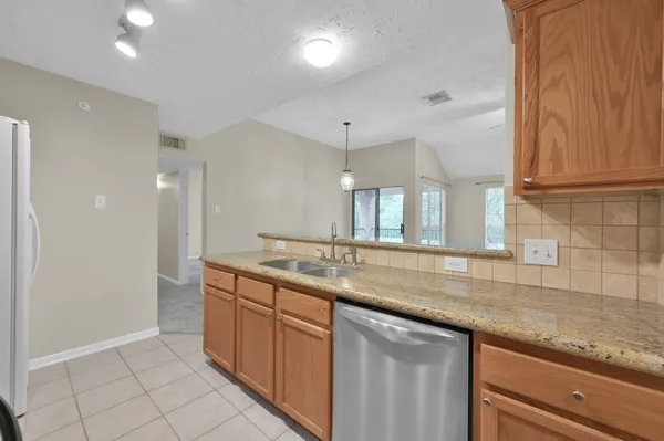 a view of a livingroom with a ceiling fan and window
