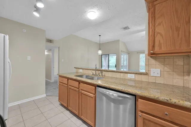 a view of a livingroom with a ceiling fan and window
