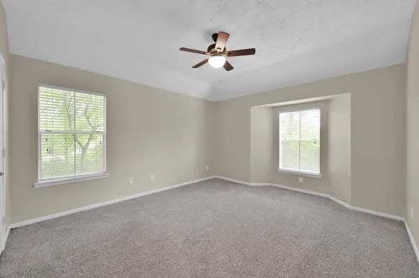 a view of n empty room with a window