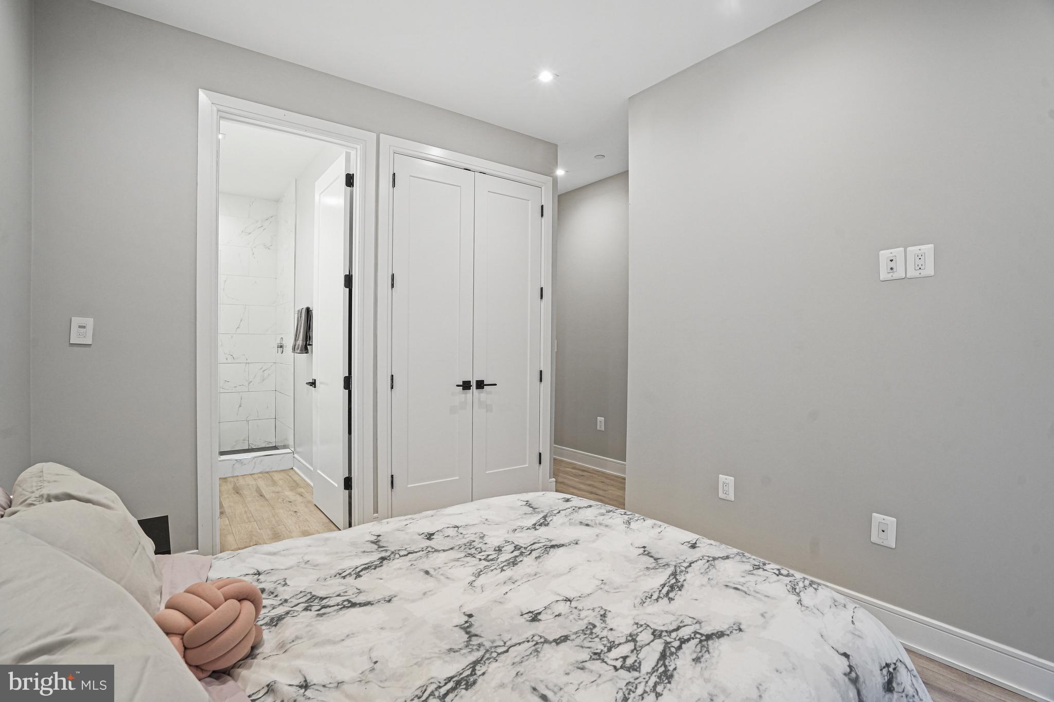 725 Euclid Street Northwest, Unit 1 Washington, DC 20001 - Photo 17 of 28 a bedroom with a bed and a bathroom