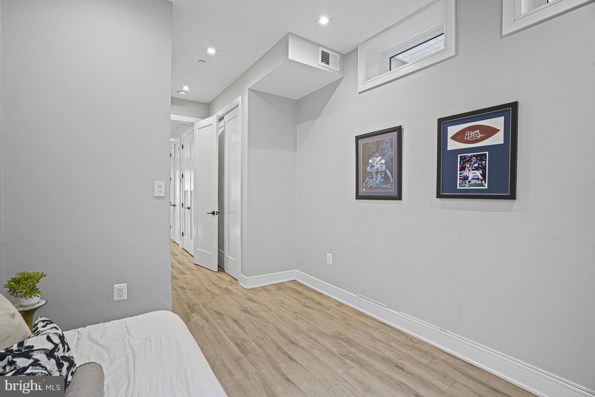 725 Euclid Street Northwest, Unit 1 Washington, DC 20001 - Photo 19 of 28 a bedroom with a bed and hallway