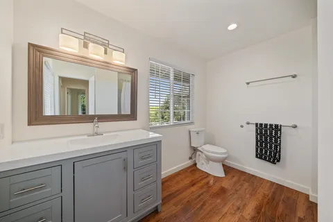 aerial view of a house with a yard and potted plants