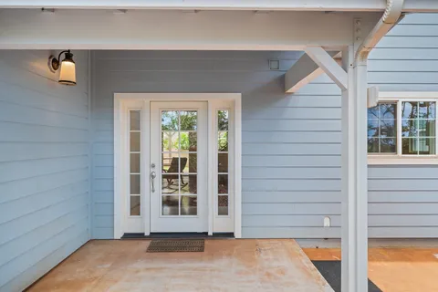 a view of a house with a backyard
