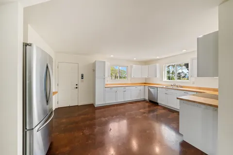 a kitchen with sink cabinets and window