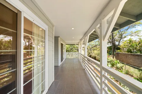 a view of a room with furniture and a window