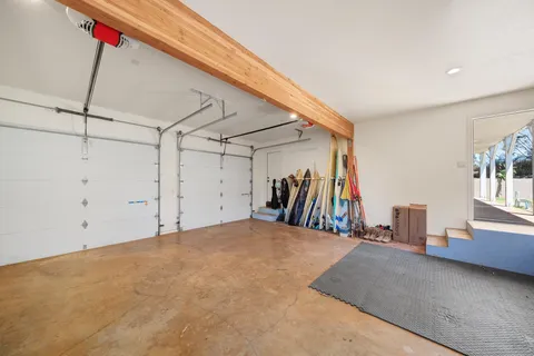 a kitchen with a refrigerator and a white cabinets