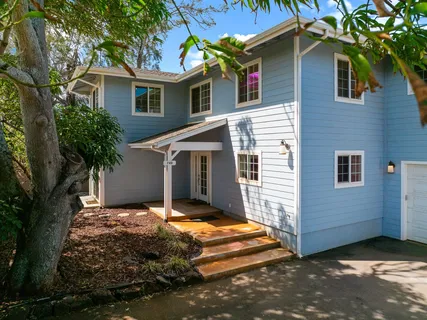 a view of a house with a yard