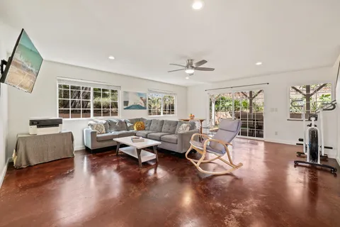 a living room with furniture and a large window