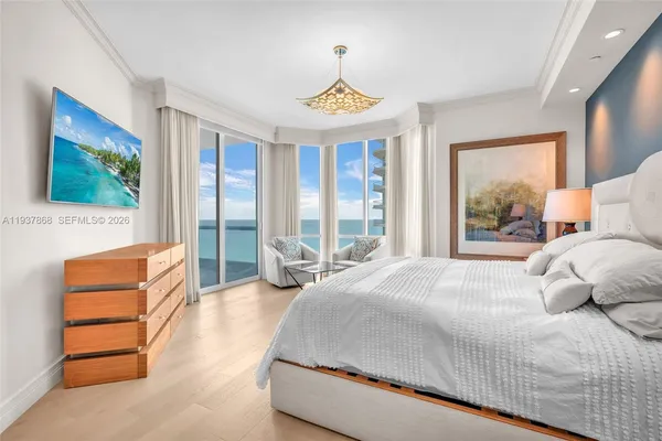 a bedroom with a bed and a couch