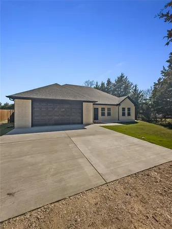 a house with trees in the background