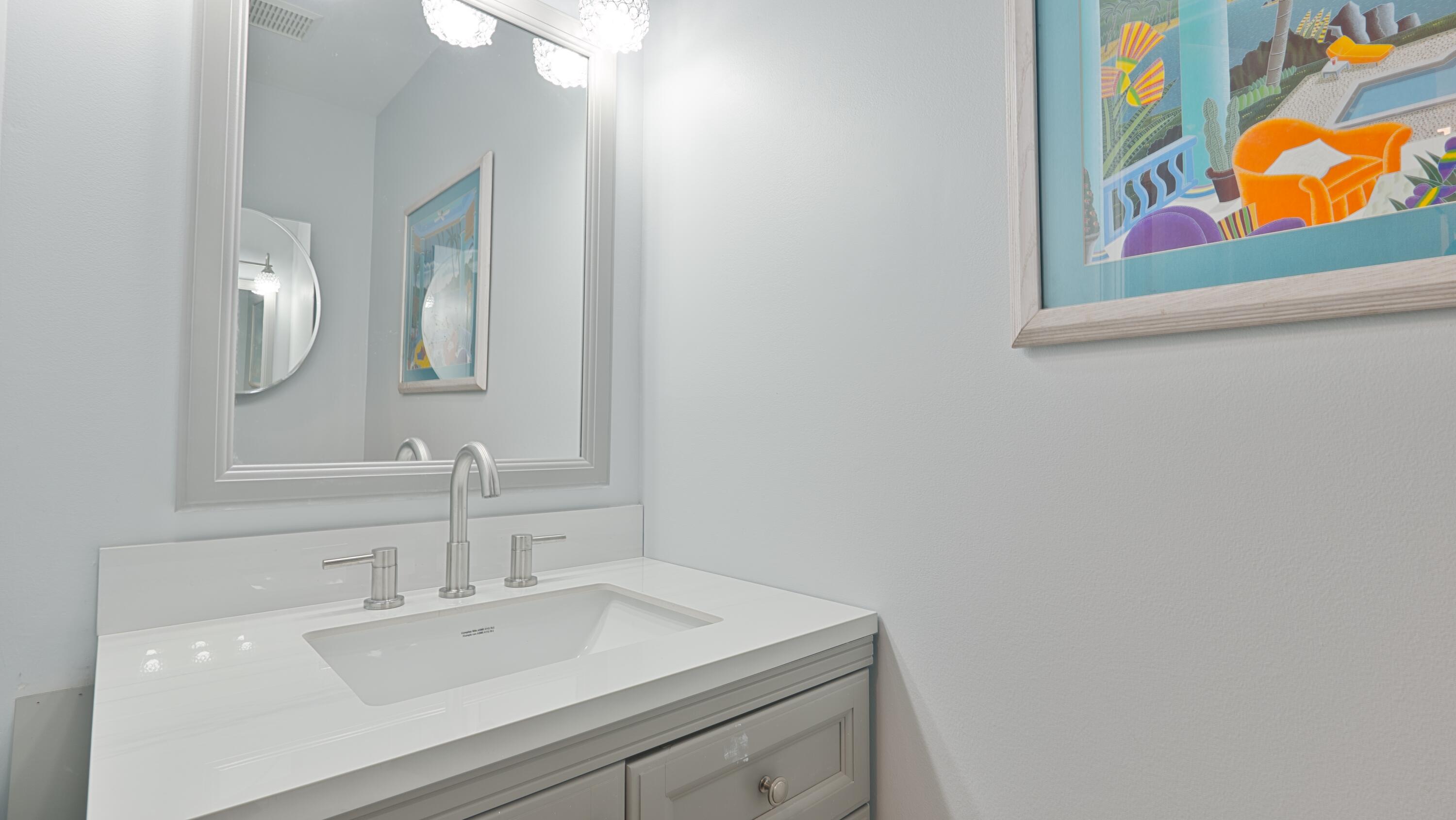 10789 Barque Court Boca Raton, FL 33498 - Photo 11 of 31 a bathroom with a sink mirror and vanity