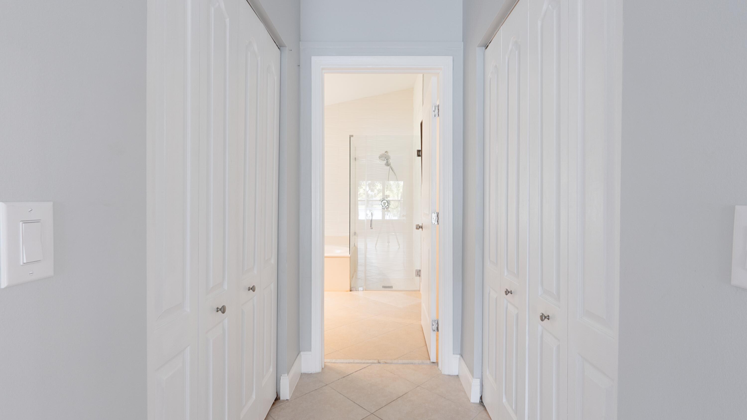 10789 Barque Court Boca Raton, FL 33498 - Photo 13 of 31 a view of a bathroom from a hallway