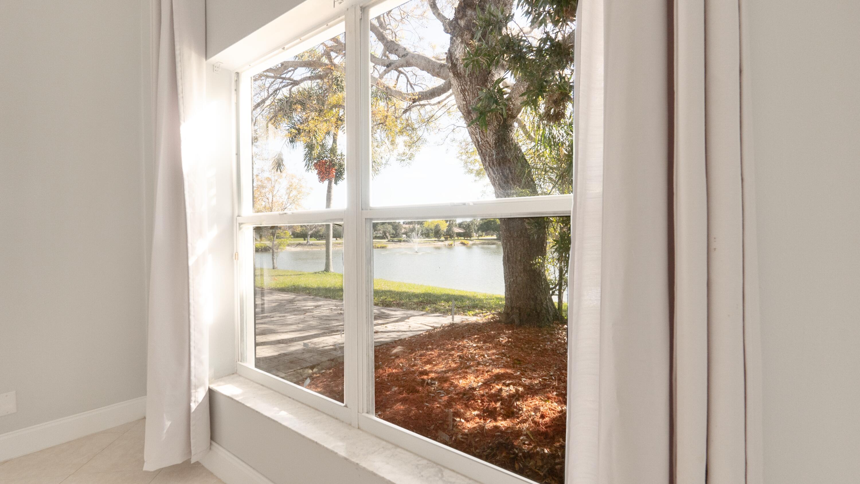 10789 Barque Court Boca Raton, FL 33498 - Photo 15 of 31 a view of a glass door with a yard from a window