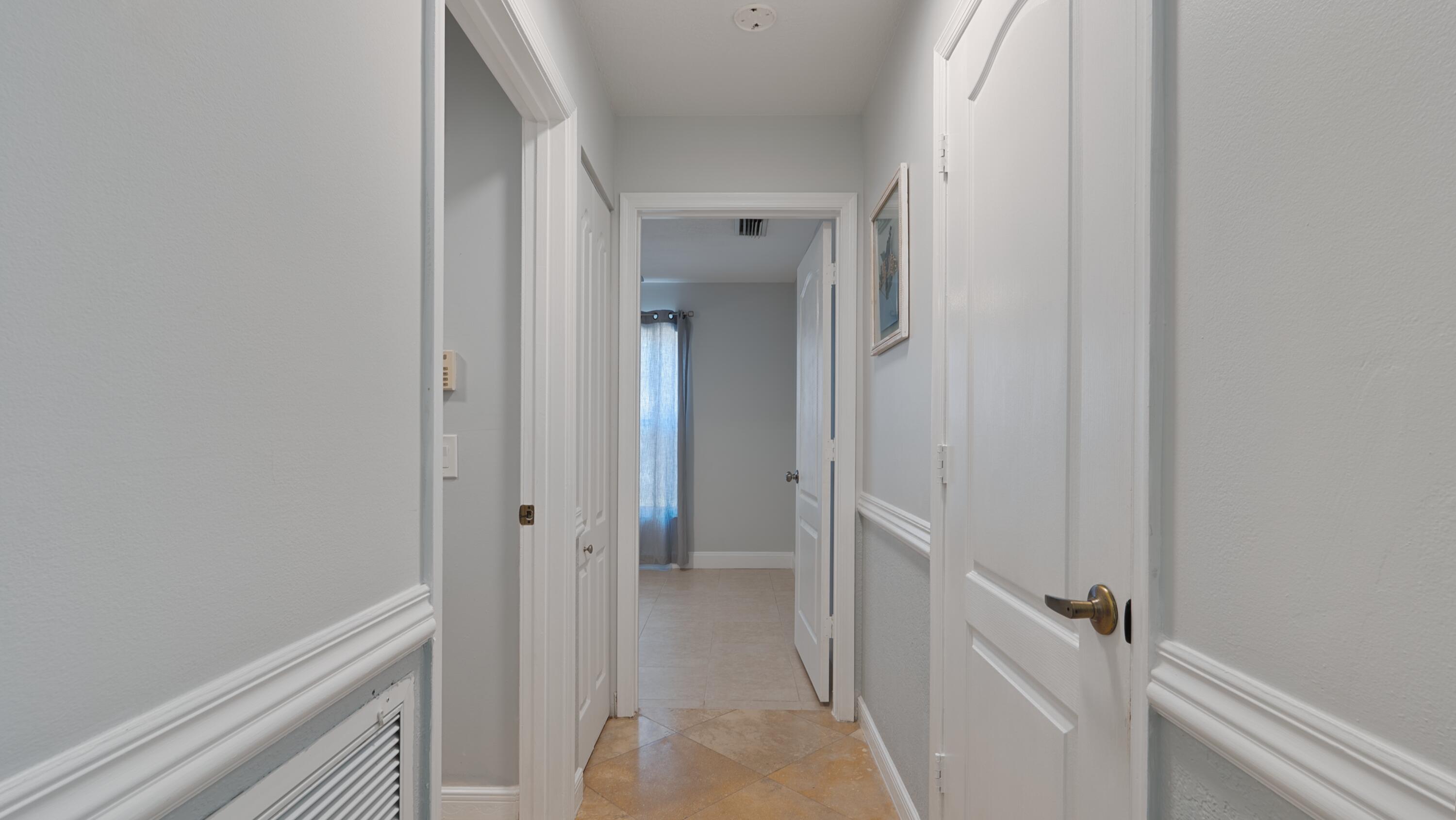 10789 Barque Court Boca Raton, FL 33498 - Photo 18 of 31 a view of a hallway with closet