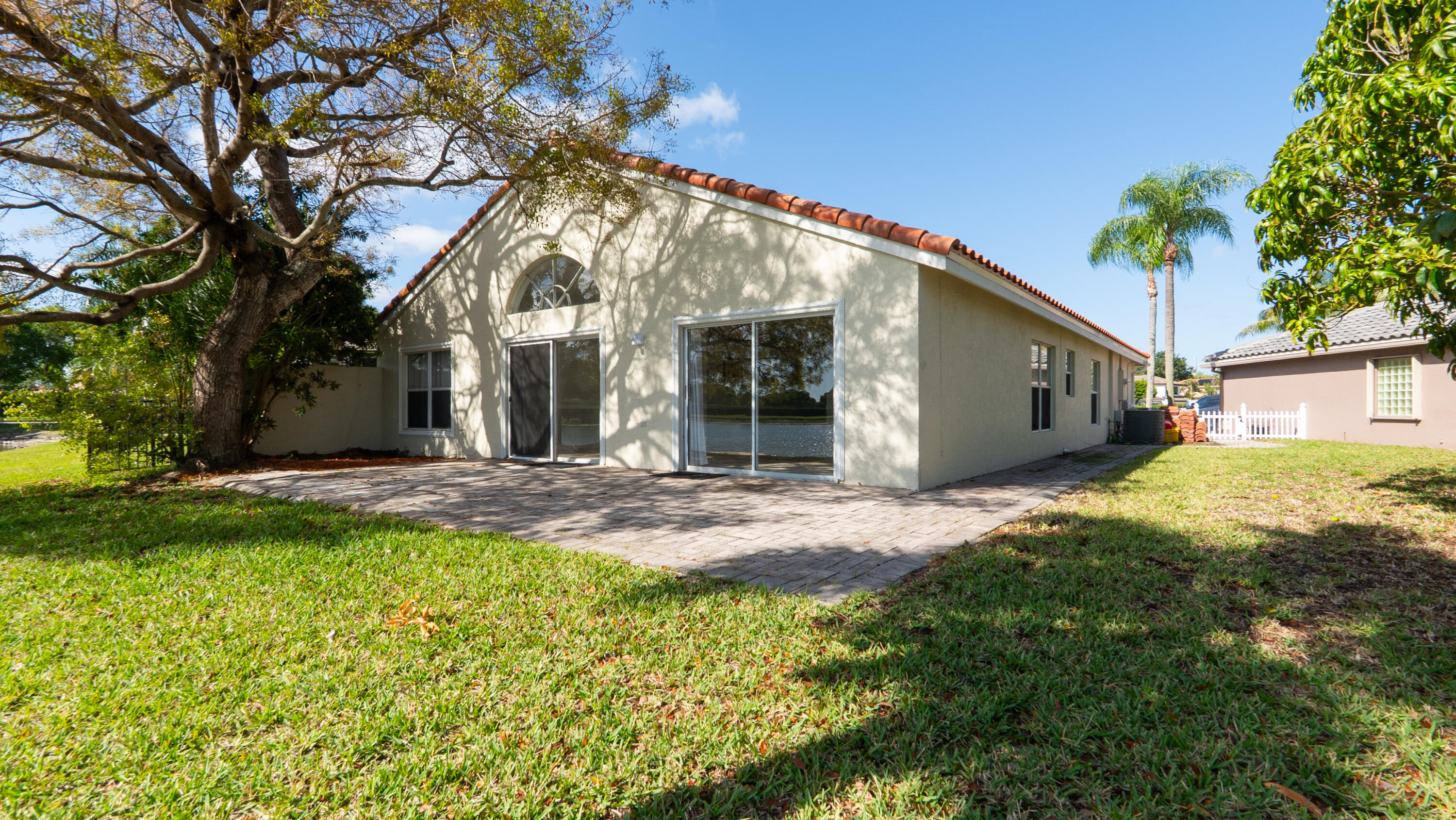 10789 Barque Court Boca Raton, FL 33498 - Photo 26 of 31 a view of a house with a yard