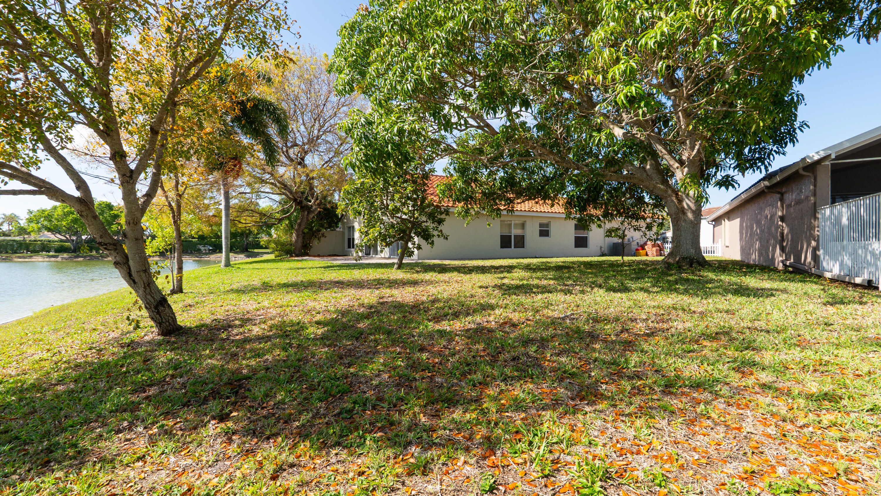 10789 Barque Court Boca Raton, FL 33498 - Photo 28 of 31 a view of swimming pool with a tree