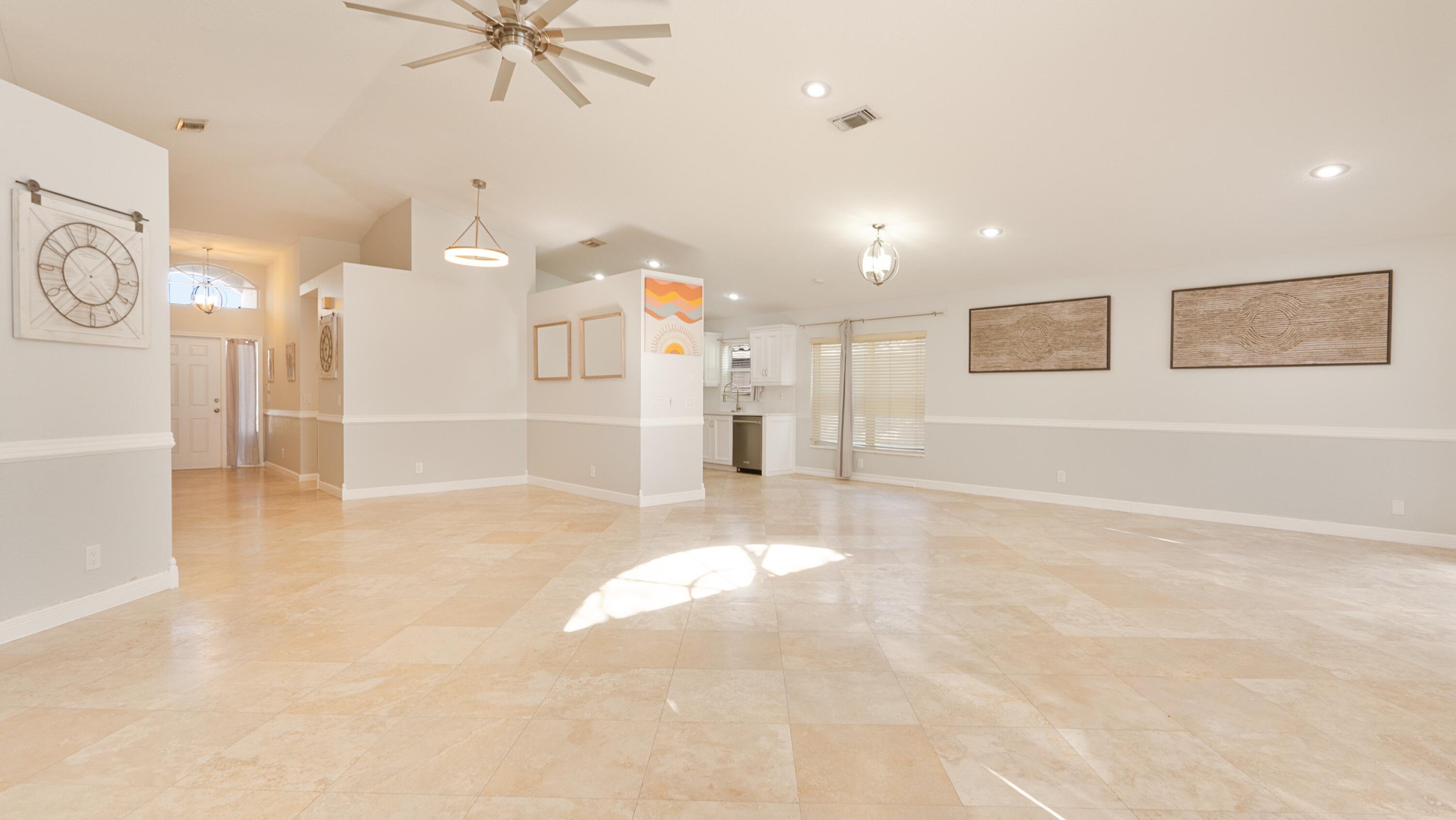 10789 Barque Court Boca Raton, FL 33498 - Photo 6 of 31 a view of a livingroom with a ceiling fan