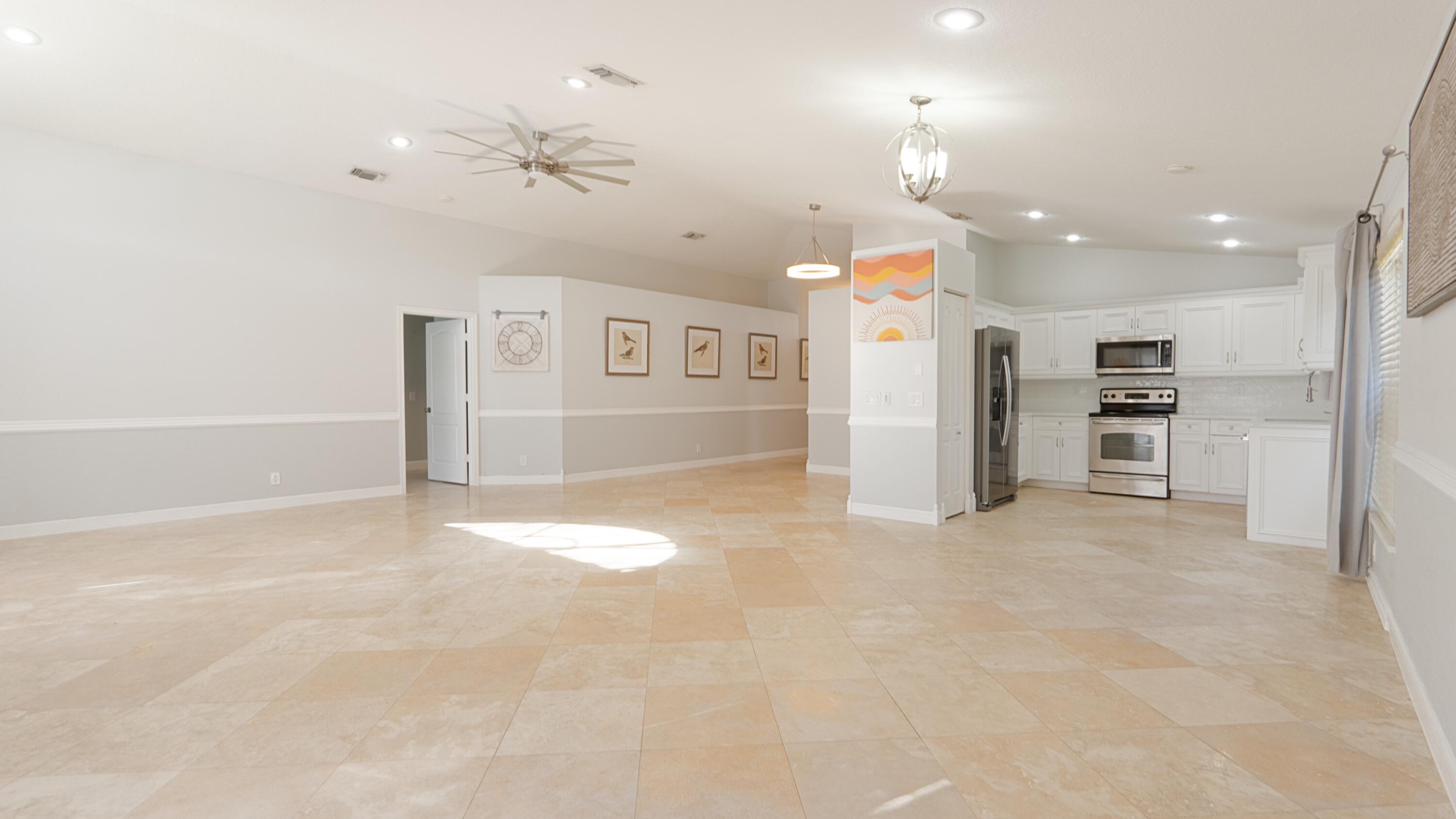 10789 Barque Court Boca Raton, FL 33498 - Photo 7 of 31 a view of a kitchen with a refrigerator and a cabinets