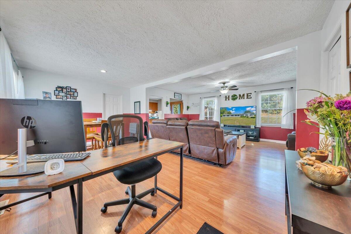 3870 Goose Dam Road Rocky Mount, VA 24151 - Photo 4 of 44 a work room with furniture and wooden floor