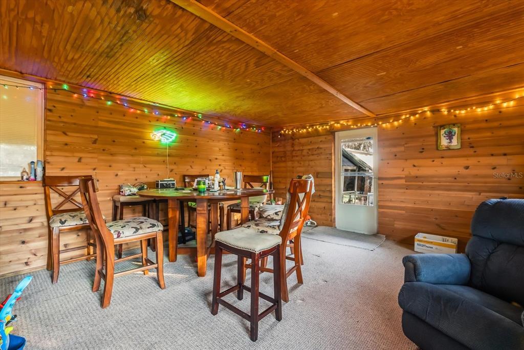 418 Glenn Road Orlando, FL 32833 - Photo 22 of 27 a view of a patio with a table and chairs