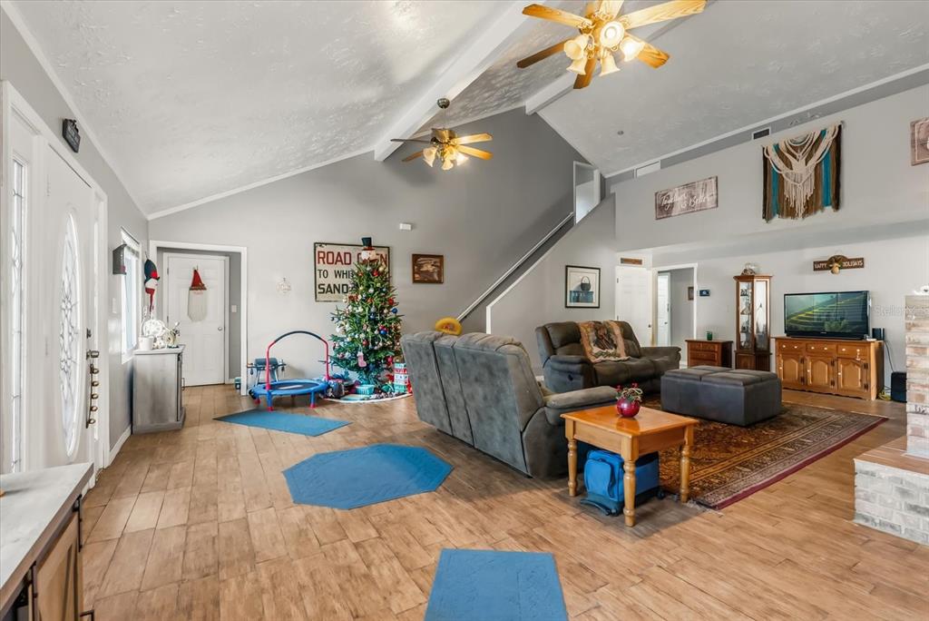 418 Glenn Road Orlando, FL 32833 - Photo 4 of 27 a living room with furniture and a wooden floor