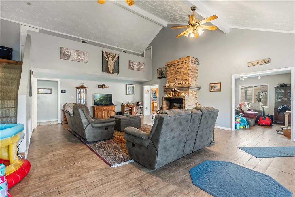 418 Glenn Road Orlando, FL 32833 - Photo 6 of 27 a living room with furniture and wooden floor