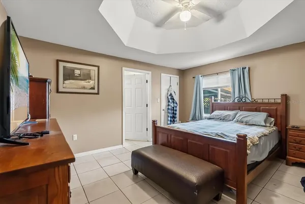 a bedroom with a bed and a desk