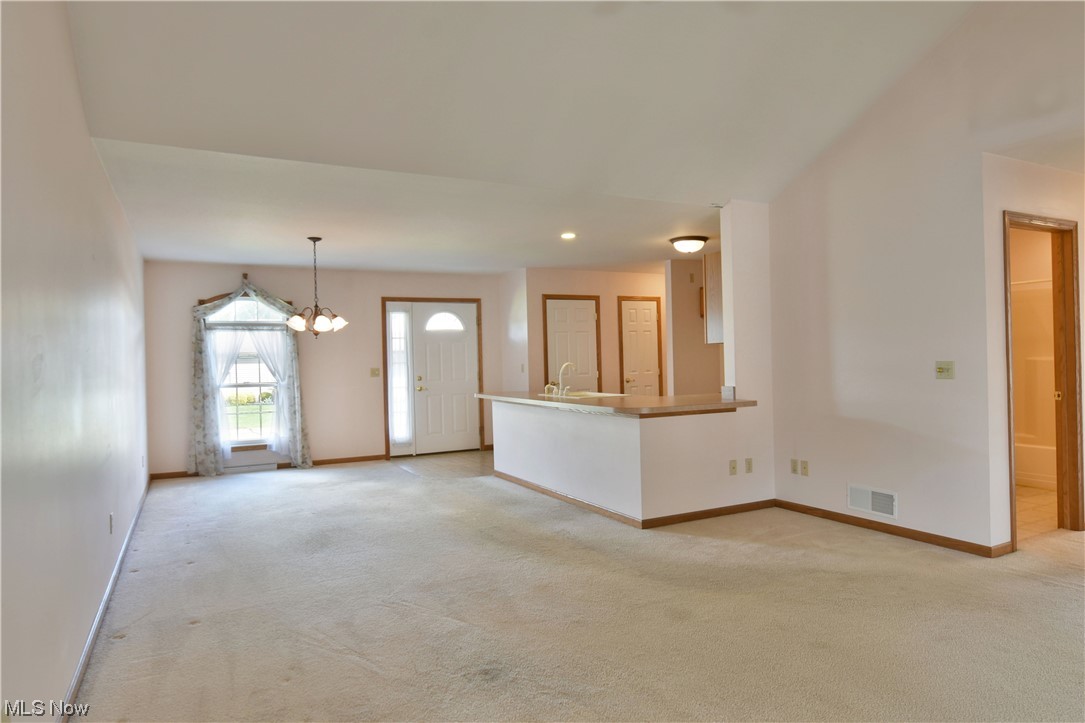 2033 East River Road, Unit 11 Newton Falls, OH 44444 - Photo 13 of 35 Living room featuring light carpet