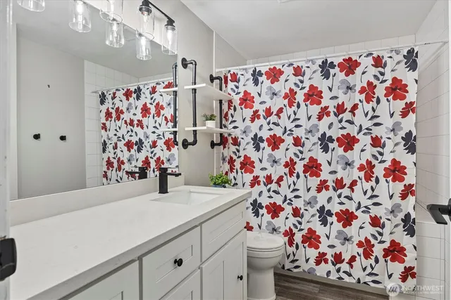 a bathroom with a sink and a curtain