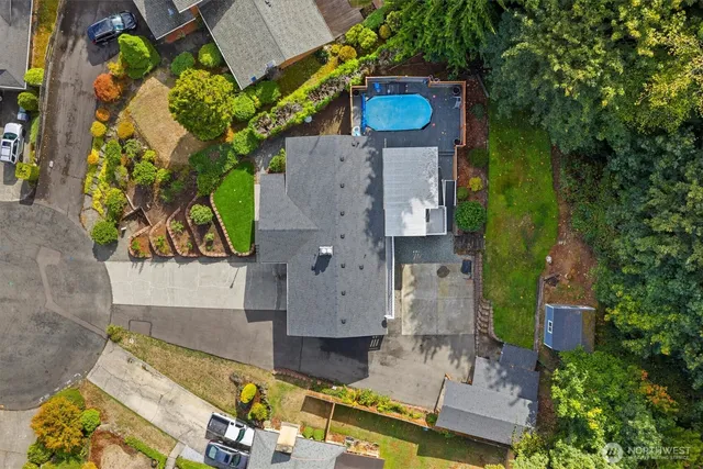 an aerial view of a house with a garden and plants