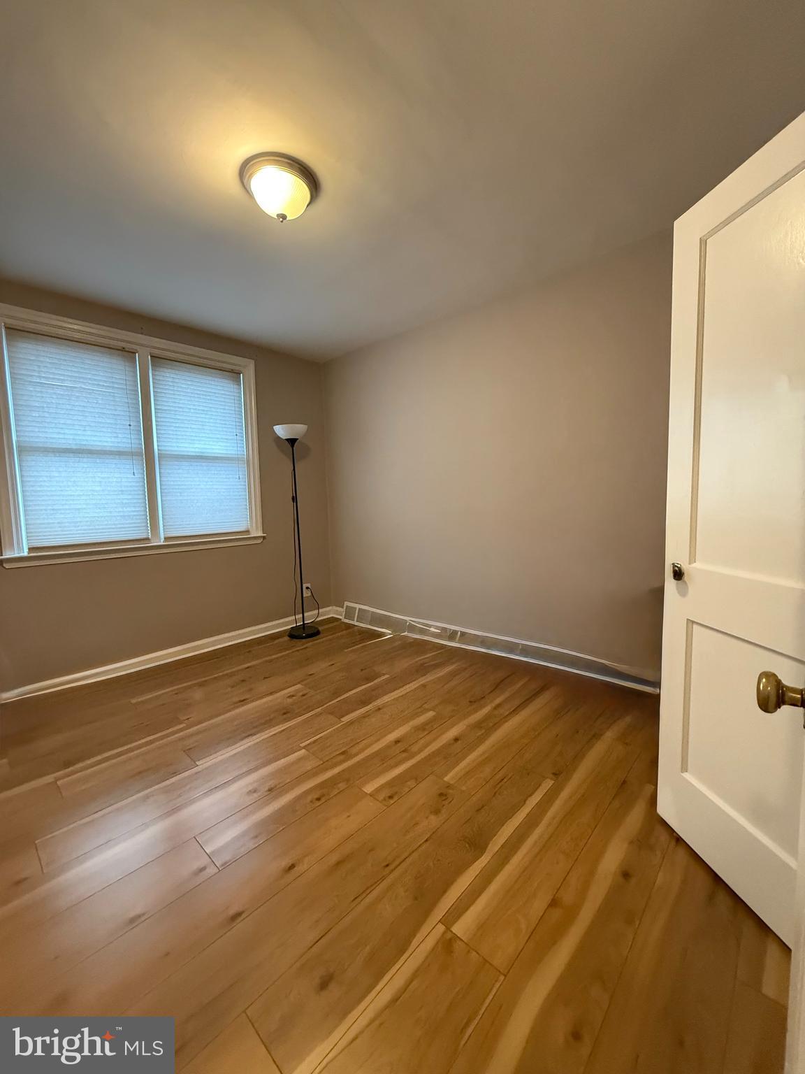 8031 Terry Street Philadelphia, PA 19136 - Photo 6 of 10 a view of empty room with wooden floor and fan