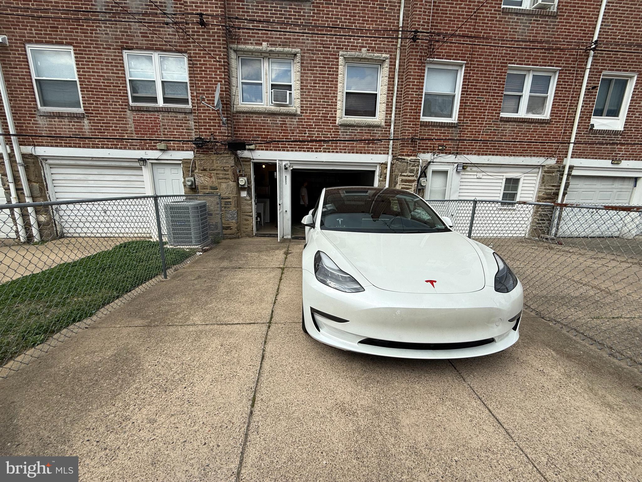 8031 Terry Street Philadelphia, PA 19136 - Photo 9 of 10 a white house with tall glass windows