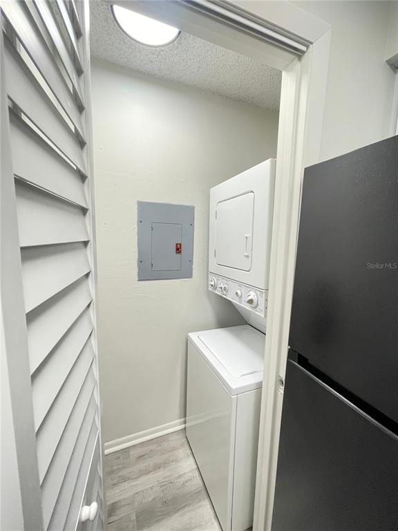241 Afton Square, Unit 203 Altamonte Springs, FL 32714 - Photo 21 of 43 a utility room with cabinets washer and dryer